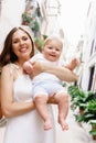 Happy and young mother holding her baby Royalty Free Stock Photo