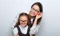 Happy young mother and laughing kid in fashion glasses hugging Royalty Free Stock Photo