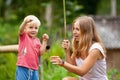 Happy young mother, little child fishing together with fun Royalty Free Stock Photo