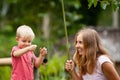 Happy young mother, little child fishing together with fun Royalty Free Stock Photo