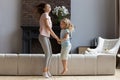 Mother with daughter holding hands dancing enjoy weekend together Royalty Free Stock Photo