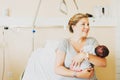 Happy young mother with newborn baby in hospital Royalty Free Stock Photo