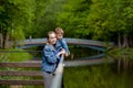 Happy young mother playing and having fun with her little baby son on warm spring or summer day in the park. Happy family concept Royalty Free Stock Photo