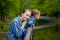 Happy young mother playing and having fun with her little baby son on warm spring or summer day in the park. Happy family concept Royalty Free Stock Photo