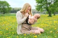 Happy Young Mother Playing with Newborn Baby Outside Royalty Free Stock Photo