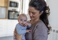 Happy mother holding infant girl at home Royalty Free Stock Photo