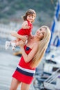 Happy young mother with a young daughter near Yacht Club Royalty Free Stock Photo