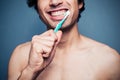 Happy young multi racial man brushing his teeth Royalty Free Stock Photo