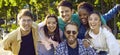 Happy young multiethnic friends men and woman smiling after summer street walk, group portrait Royalty Free Stock Photo