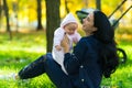 Happy young Mum playing with a cute baby girl. Royalty Free Stock Photo