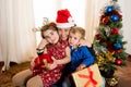 Happy Young Mum, son and daughter at Christmas Royalty Free Stock Photo