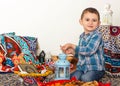 Happy young Muslim boy playing with Ramadan lantern - ready for