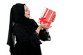 Happy young muslim woman with shopping bag and gift boxes isolated over white background Royalty Free Stock Photo