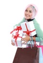 Happy young muslim woman with shopping bag and gift boxes Royalty Free Stock Photo