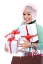 Happy young muslim woman with shopping bag and gift boxes Royalty Free Stock Photo