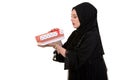 Happy young muslim woman with shopping bag and gift boxes isolated over white background