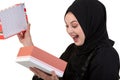 Happy young muslim woman with shopping bag and gift boxes isolated over white background Royalty Free Stock Photo