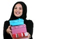 Happy young muslim woman with shopping bag and gift boxes isolated over white background Royalty Free Stock Photo