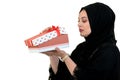 Happy young muslim woman with shopping bag and gift boxes isolated over white background Royalty Free Stock Photo