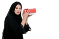 Happy young muslim woman with shopping bag and gift boxes isolated over white background Royalty Free Stock Photo