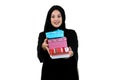 Happy young muslim woman with shopping bag and gift boxes isolated over white background Royalty Free Stock Photo