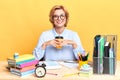 Happy young office worker sitting at the desk,having arest during working day