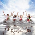 Happy young people enjoying a beach in summer with slow motion and blurry concept