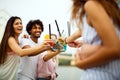 Happy young people, friends having fun on the beach and drinking cocktails together. Royalty Free Stock Photo