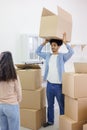 happy young people relocating to new home. purchase of residence, mortgage or rental. Royalty Free Stock Photo