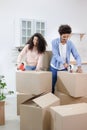 happy young people relocating to new home. purchase of residence, mortgage or rental. Royalty Free Stock Photo