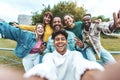 Happy young people smiling together at camera outside Royalty Free Stock Photo