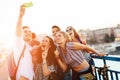 Happy young people taking selfies Royalty Free Stock Photo