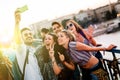 Happy young people taking selfies Royalty Free Stock Photo