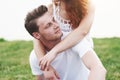 Happy young playful couple outdoors in the summer. Royalty Free Stock Photo