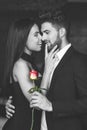 Happy young playful couple with red rose selective coloring Royalty Free Stock Photo