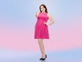Happy young plus size woman showing thumbs up