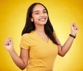 Happy, young and portrait of a beautiful woman isolated on a yellow background in a studio. Casual, smile and a gorgeous Royalty Free Stock Photo