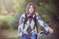 Happy young positive student going to school by bike Royalty Free Stock Photo