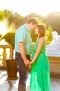 Happy and young pregnant couple hugging in nature Royalty Free Stock Photo