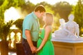 Happy and young pregnant couple hugging in nature Royalty Free Stock Photo