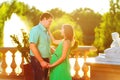 Happy and young pregnant couple hugging in nature Royalty Free Stock Photo