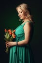 Happy young pregnant woman holding flowers Royalty Free Stock Photo