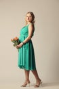 Happy young pregnant woman holding flowers Royalty Free Stock Photo