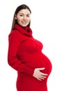 Happy young pregnant woman in red dress