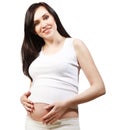 Happy young pregnant woman in white