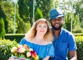 Happy young romantic couple in love. Black man and white woman. Love story and people`s attitudes. Beautiful marriage concept.
