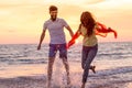 Happy young romantic couple in love have fun on beautiful beach at beautiful summer day Royalty Free Stock Photo