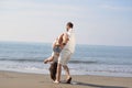 Happy young romantic couple in love have fun on beautiful beach at beautiful summer day. Royalty Free Stock Photo