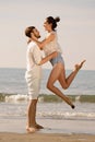 Happy young romantic couple in love have fun on beautiful beach at beautiful summer day. Royalty Free Stock Photo