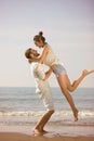Happy young romantic couple in love have fun on beautiful beach at beautiful summer day. Royalty Free Stock Photo